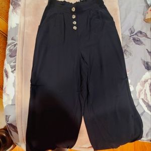 Pink Rose black wide leg pants.